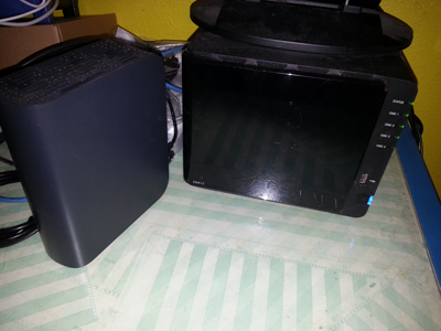 Figure 1. My Synology Diskstation DS413, shown next to one of the external hard drives it replaced.