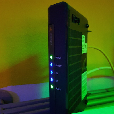 Figure 1. My office modem. Those are my office lights, green and blue, which I think look cool.