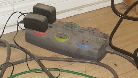 Figure 3. This is an older power strip (and it's been under my desk for a long time, hence the dust and cat hair), but the sockets are oriented away from each other and spaced well apart.